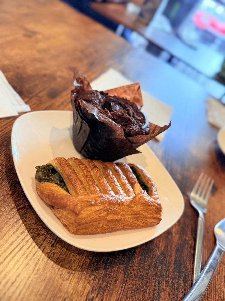 Savory pastry and chocolate muffin on a plate